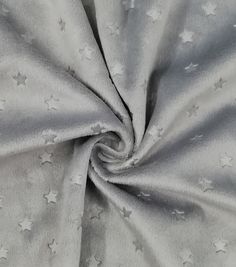 the fabric has stars on it and is light grey with white dots, as well as silver