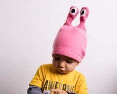 "Pink Polar Fleece Hat, Pink Snail Hat, Alien Hat, Halloween Costume, Easter Gift, Toddler Girl Hat, Toddler Boy Hat Here is a cute hat in pink. It may be a snail, it may be an alien - it is your choice what you make of it. Just had fun with this Small size fits kids 1 through 3 years of age approximately - Head Circumference: 18\" to 20\" (46 - 51 cm). Medium size will fit anyone with head circumference 20\" to 22\" (51 - 56 cm) Large size will fit anyone with head circumference 22\" to 24\" (5 Playful Adjustable Hats For Halloween, Playful Halloween Costume Cap, Playful Adjustable Halloween Hats, Playful Winter Costume Hats And Headpieces, Spring Adjustable Pink Costume Hat, Adjustable Pink Halloween Costume Hat, Pink Halloween Costume Hat, Playful Pink Hat For Halloween, Whimsical Pink Headband Costume Hat