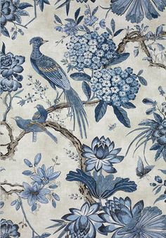 a blue and white floral wallpaper with birds on it