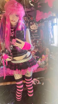 a mannequin dressed in pink and black with lots of stuff on the floor