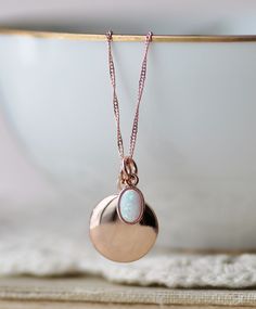 "A sweet new locket made with rose gold and an opal charm. Locket is rose gold plated and hangs from dainty rose gold plated chain. A small opal charm hangs off the side. See details and lengths below. * Locket - 13mm (1/2\") * Singapore chain -Adjusts to 18\" and 20\" only (has small ring to connect clasp at 18\" and 20\" lengths along chain) * Satellite Chain - Adjusts from 16-18\", or 18-20\" * Opal charm - Lab created opal, 6x4mm Please choose desired chain style and length at checkout. List Gold Opal Necklace, Dainty Rose, Locket Pendant Necklace, Necklace Rose Gold, Necklace Rose, Small Rings, Opal Necklace, Rose Gold Necklace, Gold Plated Chains