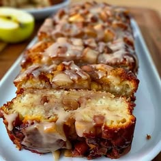 a loaf of cinnamon apple bread on a white plate