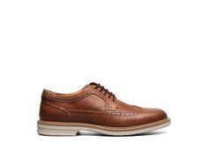 Florsheim Norwalk Wingtip Men’s Oxford Versatile style for a classic look in the Florsheim Norwalk Wingtip Oxford. With a leather upper featuring a sleek wingtip design, this lace-up Shoe dresses up jeans or a sport coat. The Comfortech footbed & TPU midsole enhance comfort while the Flexsole Technology in the outsole is lightweight and durable. Leather upper Lace-up closure Suedetec linings Comfortech footbed TPU midsole/outsole Cognac Wingtip Shoes For Business Casual, Dress Up Jeans, Rack Room, Room Shoes, Wingtip Oxford, Versatile Style, Sport Coat, Lace Up Shoes, Classic Looks