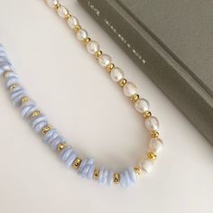 Welcome to StoneNestJewellery, where each piece tells a story of craftsmanship and elegance. Behold our unique statement necklace, meticulously handcrafted with high-quality natural gemstones - Seraphinite, Baroque-style pearls, and the soothing energy of light blue Agate. 🌿 Unique and Statement Design: Elevate your style with this one-of-a-kind necklace, where the enchanting combination of white pearls, light blue Agate, and Seraphinite creates a statement piece that is both unique and captivating. ✨ Benefits of Agate: Embrace the grounding and soothing properties of Agate. Known for enhancing mental clarity and concentration, Agate is believed to bring balance and stability to the wearer, promoting harmony and a sense of calm. 🎨 White Pearls and Light Blue Agate: The harmonious blend o Long Natural Stones Pearl Necklace For Jewelry Making, Long Pearl Necklace With Natural Stones For Jewelry Making, Pearl Necklaces With Natural Stones For Jewelry Making, Pearl Necklaces With Natural Stones For Gifts, Pearl Pendant Necklace With Gemstone Beads, Pearl White Necklaces With Natural Stones, Pearl White Gemstone Necklace Gift, Pearl White Gemstone Necklace For Gift, Bold Pearl Necklace