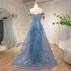 a blue dress on display in a room