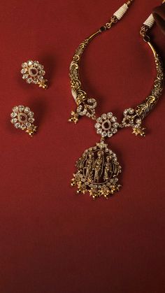 This stunning silver hasli necklace showcases intricate nakshi designs that accentuate timeless Indian floral and ivy patterns. At the pinnacle of the necklace sits a statue of Lord Ram, with his wife Sita, brother Lakshmana and his devotee Lord Hanuman, adding to its allure. The charm of this exceptional vintage collar necklace is further enhanced by the dangling cluster of rice pearls, making it a definite head-turner. Festive Filigree Temple Necklace For Puja, Ornate Temple Necklace With Meenakari For Puja, Ornate Meenakari Necklace For Puja, Ornate Meenakari Necklaces For Puja, Ornate Meenakari Temple Necklace For Puja, Temple Jewelry Filigree Necklace For Puja, Temple Jewelry Chandbali Necklace With Filigree, Ornate Temple Necklace For Navratri Rituals, Ornate Temple Necklace For Puja With Intricate Design