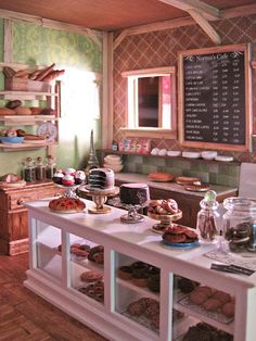 an image of a kitchen with food on the counter and menus in the background