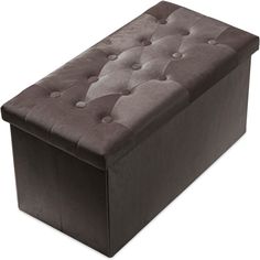 a large brown ottoman with buttons on the top and bottom part, sitting in front of a white background