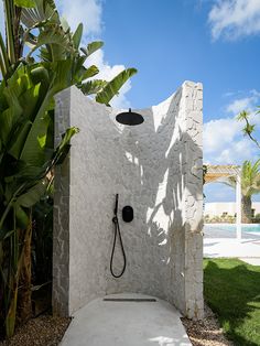 an outdoor shower in the shape of a house