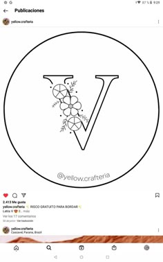 the letter v is made up of grapes and leaves in a circle with an arrow