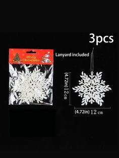 three white snowflakes hanging from strings on a black background with the measurements for each ornament