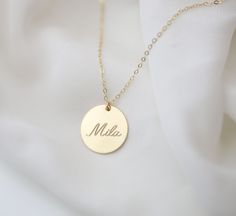 Personalized large circle disk tag necklace in Gold filled or Sterling silver. Have this custom necklace personalized with your child's name, your name, initials or any meaningful word of your choice. This necklace is perfect for a special meaningful keepsake gift for mom, friend wife or that special someone. OPTIONS Material: SS// for Sterling silver GF// for Gold filled Disk size : 16mm // 19mm Cubic Zirconia charm: You can choose from the drop down bar menu to add a 4mm CZ charm PLEASE READ B Personalized Name Necklace With Round Pendant, Round Pendant Name Necklace For Personalized Gift, Customized Round Jewelry For Everyday, Customized Jewelry For Everyday Wear, Personalized Adjustable Sterling Silver Initial Necklace, Personalized Round Pendant Name Necklace As A Gift, Custom Name Round Pendant Necklace For Gift, Personalized Sterling Silver Initial Necklace For Mom, Round Pendant Name Necklace With Custom Name For Birthday