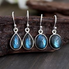 Pear Shape Blue Fire Labradorite Dangle Earring, Oval Blue Fire Labradorite Dangle Earring, Labradorite Plain Sterling Silver Dangle Earring Stone Name:-  Labradorite Weight (Approx.):- 3.70 Gram (Pear) Weight (Approx.):- 2.90 Gram (Oval) Full Length:- 28 mm Length:- 16 mm (without ear wires) Width:- 09 mm  Height:- 06 mm Stone Size (Approx.):-  12 x 8 mm Pear Stone Size (Approx.):-  11 x 9 mm Oval Total number of stones:  2 Stone setting: Bezel setting Metal: 925 sterling silver Finish: Silver High Polish GN-E-1020 Blue Labradorite Earrings As A Gift, Handmade Blue Labradorite Earrings, Blue Labradorite Gemstone Earrings, Blue Gemstone Labradorite Earrings, Labradorite Teardrop Earrings As Gift, Labradorite Teardrop Earrings For Gift, Funky Jewelry, Sterling Silver Dangle Earrings, Blue Fire