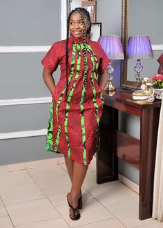 Midi Turtle Neck Ankara Dress, Dress With Pockets, Wedding Guest Dress, African Print Dress, Formal Dress This beautifully crafted classy, easy-to-wear Ankara dress is made with 100% cotton African wax print floral fabric. it is suitable for both formal and informal occasions. Features: - 100% Handmade - Fitted with zipper at the back - Short sleeve - Pocket at both sides - Length of the dress on the model is 42inches Buyers can request customization if the measurement is different from the stan Green Sheath Wedding Dress, Traditional Knee-length Formal Dresses, Green Short Sleeve Midi Dress For Wedding, Wedding Guest Dress African, African Print Dress Styles, African Midi Dress, Dress African Print, African Print Dress Ankara, Mother Of The Bride Dresses Long