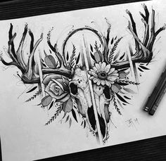 a pencil drawing of a deer skull with flowers and antlers on it's head