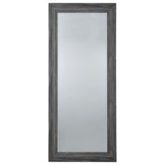 a mirror that is sitting on top of a wall next to a white wall with a black frame