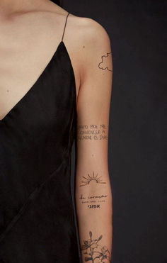 a woman's arm with tattoos on it, and the words written in different languages