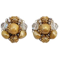 These stylish retro clip on earrings feature clusters of caramel beads and sparkling aurora borealis crystals. Silver and brass tone. Mid Century Earrings, Vintage Jewlery, Aurora Borealis Crystal, Crystal Cluster, Vintage Costume Jewelry, Aurora Borealis, Vintage Costumes, Recipes Easy, Vintage Earrings