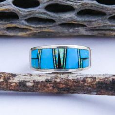 (eBay) Find many great new & used options and get the best deals for Navajo Turquoise Multi Gemstone Inlay Sterling Silver Ring Band Size 9 at the best online prices at eBay! Free shipping for many products! Artisan Turquoise Opal Ring, Traditional Turquoise Inlay Ring, Southwestern Style Turquoise Inlay Ring, Southwestern Style Multicolor Inlay Rings, Unique Blue Turquoise Ring With Inlay, Luxury Sterling Silver Turquoise Inlay Ring, Vintage Sterling Silver Turquoise Ring With Inlay, Silver Ring Band, Navajo Rings