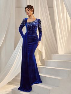 Belt : NoPockets : NoLength : LongMaterial : FlockingColor : Royal BlueFabric : Slight StretchWaist Line : High WaistHem Shaped : MermaidSleeve Length : Long SleeveNeckline : Asymmetrical NeckBody : Lined top, unlined bottomDetails : Contrast Sequin, Ruched, ZipperComposition : 95% Polyester, 5% ElastaneCare Instructions : Hand wash, do not dry clean Size US Bust Sleeve Length Waist Size Hip Size Length XS 2 75 61.8 61 84 155.8 S 4 80 63 66 89 157 M 6 85 64.2 71 94 158.2 L 8/10 90 65.4 76 99 159.4 XL 12 95 66.6 81 104 160.6 Blue Velvet Dress Long Classy, Velvet Gowns Evening Dresses, Blue Long Sleeve Mermaid Dress For Evening, Elegant Blue Velvet Evening Dress, Embellished Royal Blue Long Sleeve Dress, Blue Long Sleeve Glamorous Mermaid Dress, Velvet Gowns, Royal Family Fashion