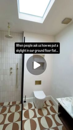 a bathroom with a skylight above the toilet