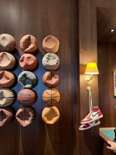 there are many hats hanging on the wall