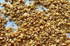 chopped granola on a baking sheet ready to be baked