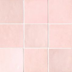 a white and pink tiled wall with small squares