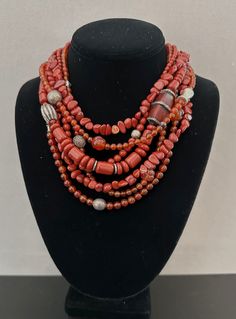 One-of-a-kind statement necklace handcrafted in Scottsdale, Arizona. Beads: 7 strands of red jasper, carnelian, antique and sterling silver Dimensions: approximately 20" + 2" extender Make a statement with this timeless treasure! ﻿Free Shipping ﻿Refund Policy Multi-strand Red Coral Necklace With Polished Beads, Unique Red Multi-strand Jewelry, Red Hand-strung Multi-strand Jewelry, Multi-strand Red Coral Beaded Necklaces With Polished Beads, Handmade Multi-strand Red Coral Jewelry, Artisan Multi-strand Red Beads, Artisan Red Carnelian Beaded Necklaces, Artisan Red Carnelian Beaded Necklace, Artisan Multi-strand Red Necklaces