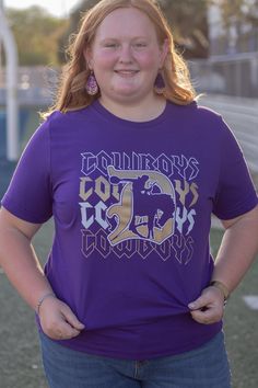 These Cowboy game day tees definitely have a rock n roll vibe on repeat! Size: 3X Show your spirit in this navy unisex tee. This tee typically ships within 1 to 2 days. Shop Great Gifts at MainStreet Mercantile. Graphic Tee With Text Print For Game Day, Purple Graphic Print Top With Team Spirit Style, Purple Graphic Print Top For Team Spirit, Game Day Graphic Tee With Text Print, Purple Letter Print Tops For Game Day, Casual Purple T-shirt For Fan Gear, Collegiate Purple Top For Game Day, Purple Team Spirit Graphic Print Top, School Spirit T-shirt With Graphic Print For Baseball Season