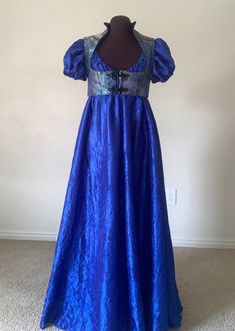 Hello!  I am currently doing sales outside of etsy.  Please contact desree10@yahoo.com and I can accept cards thru paypal and venmo for a 10% discount of the listed price. Thank you! This vibrant, elegant gown is the perfect ensemble for this years' renaissance or regency era events! The full-length, royal blue dress is a beautiful lightweight crushed taffeta that can be machine washed and  dried.  The neckline is elasticized and can be pulled low off the shoulders and easily adjusted to your de Regency Gown Ball, Regency Evening Dress, Blue Satin Dress For Costume Party, Luxury Regency Style Dress With Boned Bodice, Regency Ball Gown, Blue Fantasy Dresses For Fantasy Events, Regency Blue Dress, Regency Era Dress, Regency Style Blue Dress With Historical Design