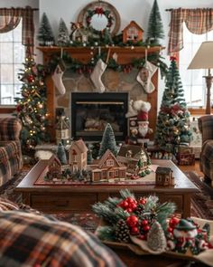 a living room decorated for christmas with plaid furniture and holiday decorations on the fireplace mantel