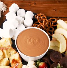 an assortment of snacks including marshmallows, pretzels, and chocolate