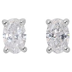 Exquisite 1.01ct Diamonds Stud Earrings in 18k White Gold - GIA Certified Introducing a pair of exquisite 18k white gold diamond stud earrings, featuring two stunning oval-shaped diamonds. These earrings are designed for both elegance and comfort, making them perfect for any occasion. Certified by GIA, it guarantees the highest standards of quality and authenticity. Metal: 18k White Gold Main stone: 2 pcs Diamonds Main stone carat weight: 1.01ct Shape: Oval Color grade: D Clarity grade: VVS1-VVS White Diamond Cut Earrings For Formal Events, Classic White Marquise Earrings, White Single Cut Lab Grown Diamond Earrings, White Earrings With Single Cut Lab-grown Diamonds, Classic Gia Certified Marquise Diamond Earrings, White Gia Certified Diamond Earrings For Formal Occasions, Timeless White Diamond Earrings With Diamond Cut, Classic Gia Certified Marquise Earrings, White Moissanite Diamond Earrings With Single Cut Diamonds