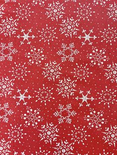 a red background with white snowflakes on it