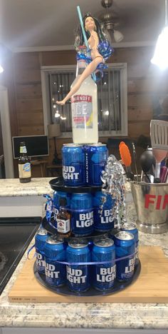 a stack of blue cans sitting on top of a counter