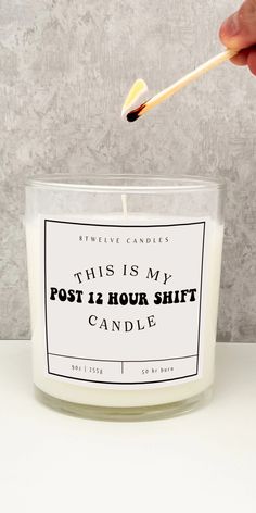 this is my post 12 hour shift candle with an orange and white stick sticking out of it