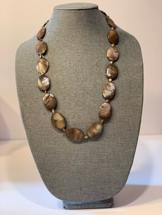 Beautiful, brown abalone, beaded shell necklace, 29.5 inches long. Each oval abalone bead is just under 1.5 inches long and 1 inch wide. The large, flat beads are separated by small, abalone shell, rectangular beads about .5 inches long. All the markings are natural; no damage. Both sides of the unique hook clasp are stamped 925. Timeless necklace. Perfect for work or leisure. Has an Eileen Fisher feel. Very good condition. Beaded Shell, Shell Beads Necklace, Crochet Unique, Flat Beads, Handcrafted Necklace, Shell Beads, Abalone Shell, Shell Necklaces, Eileen Fisher