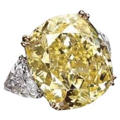 Magnificent classic design for this refined ring in 18k gold with a GIA certified natural fancy yellow diamond , cushion cut, of 5,00carats, VVS2 clarity, so clean and brilliant, with two side natural diamonds in trillions cut . A very piece of art. Investment ring. Complete with GIA report. Whosale price. Fancy Yellow Diamond Ring, Radiant Diamond Rings, Cushion Diamond Ring, Yellow Cushion, Yellow Diamonds Engagement, Cushion Cut Diamond Ring, Yellow Diamond Engagement Ring, Art Investment, Yellow Diamonds