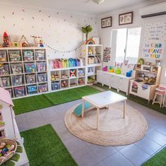 a child's playroom with toys and bookshelves