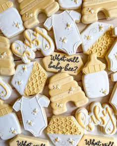 baby shower cookies are arranged on a table