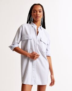 Elevate your wardrobe with the Abercrombie & Fitch Women's Oxford Mini Shirt Dress, a blend of classic style and modern comfort. This chic piece is perfect for any casual occasion or a smart-casual office setting.

- **Size**: M Petite
- **Color**: Blue Stripe
- **Material**: Cotton, Polyester
- **Gender**: Female
- **Features**: Functional button-through detail, chest pockets with flap closure, classic collar

Crafted from a premium mix of cotton and polyester, this dress offers both durability Collared Cotton Shirt Dress With Pockets, Relaxed Fit Collared Shirt Dress With Pockets, Cotton Collared Shirt Dress, Collared Cotton Shirt Dress With Button Closure, Collared Shirt Dress With Buttoned Pockets And Relaxed Fit, Relaxed Fit Collared Shirt Dress With Buttoned Pockets, Cotton Collared Shirt Dress With Button Closure, Collared Shirt Dress With Buttoned Pockets For Day Out, Spring Shirt Dress With Collared Neckline And Pockets