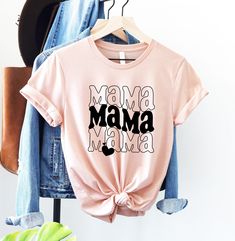 Mama Shirt, Mothers Day Shirt, Mom Shirt, Mom Life Shirt, Funny Mom Shirt, Gift for Mom, Mothers Day Gift, Mama Tshirt, Shirt for Mom HOW TO PLACE YOUR ORDER * Choose your t-shirt color * Choose your size * Choose your design&text color * PLEASE make sure all your order's steps PRODUCT DESCRIPTION T-shirt feels soft and light, with just the right amount of stretch. It's comfortable and the unisex cut is flattering for both men and women. * Solid colors are 100% combed and ring-spun cotton * Ash color is 99% combed and ring-spun cotton, 1% polyester * Heather colors are 52% combed and ring-spun cotton, 48% polyester * Athletic and Black Heather are 90% combed and ring-spun cotton, 10% polyester * Heather Prism colors are 99% combed and ring-spun cotton, 1% polyester * Fabric weight: 4.2 oz/ Funny Graphic Print Tops For Everyday, Mother's Day Graphic Tee With Text Print, Mother's Day Cotton Slogan Tops, Pink Funny Shirt With Letter Print, Trendy Tops With Funny Text For Mother's Day, Pink Funny Letter Print Shirt, Funny Print Short Sleeve Shirt For Mother's Day, Mother's Day Crew Neck Shirt With Text Print, Funny Letter Print Pink Shirt