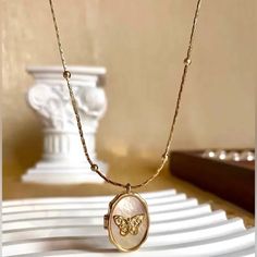 Features A Shell Adorned Locket With A Graceful Butterfly Molded In 14k Gold. Chain Length: 15.4 Inch Materials: Brass, Cubic Zirconia Butterfly Locket Necklace, Butterfly Locket, Sunshine Girl, Gold Locket Necklace, Oval Locket, Oval Necklace, Butterfly Pendant Necklace, Crafts Jewelry, Diy Crafts Jewelry