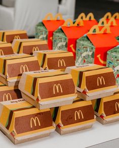 many boxes are stacked on top of each other at a mcdonald's birthday party