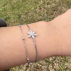 Minimalist Daisy Flower Silver Bracelet Gift for Bestfriend, Gift for Woman ⭐ All of our products are handmade and their materials are 925 sterling silver. ⭐ Bracelet lenght : 7.4'' (19 cm) ⭐ Bracelet weight : 3.10 gr ⭐ Materials: Silver ⭐ Nickel free hypoallergenic for sensitive skin. ⭐ Lightweight, perfect for everyday wear. ⭐ All of our products are handcrafted and ± 5% deviation may occur in grams and sizes. ⭐ If you have any question, contact us freely. ⭐ The light color of the photos may vary on computer and phone.      --- Care Guide --- * Unfortunately, 925 sterling and all other silver types tarnish in time. So the question is; How can we slow it down? * Contact with water: Not a great idea. But, it is unlikely to do any lasting damage. Just make sure to dry it after. * Swimming P Dainty Silver Flower Charm Bracelet, Silver Flower Jewelry For Friendship, Silver Bracelets With Flower Charm For Mother's Day, Dainty Sterling Silver Bracelet With Flower Charm, Dainty Adjustable Flower-shaped Bracelet, Adjustable Delicate Sterling Silver Bracelet Gift, Elegant Flower-shaped Jewelry For Friendship, Dainty Silver Flower Bracelets, Delicate Silver Bracelets With Flower Charm