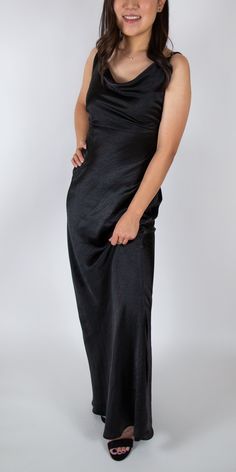 Sexy, sleek, and feminine. This satin cowl neck maxi is perfect for any formal occasion. The perfect touches of sexiness and sophistication. Brand: Nasty Gal Retail Price: $72 Color: Black Hidden Zippered Half Back Polyester Adjustable Straps Model Info: Height: 5'2 Waist: 25'' Wearing a size US 2 *Style notes: This dress has some stretch! Chic Maxi Dress With Cowl Back For Party, Formal Floor-length Bias Cut Slip Dress, Chic Cowl Back Maxi Dress For Night Out, Sleek Formal Floor-length Slip Dress, Satin Cowl Neck Maxi Dress For Formal Occasions, Satin Maxi Dress With Cowl Neck For Formal Events, Formal Satin Maxi Dress With Cowl Neck, Chic Satin Maxi Dress With Cowl Neck, Cowl Back Maxi Dress For Prom