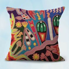 a decorative pillow with colorful designs on it