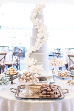 a wedding cake and desserts on a table