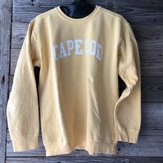 The Cape Cod Crewneck Sweatshirt is hand-dyed in small batches and smells as fresh as it looks! A top-seller, this comfort colored yellow Cape Cod Crew is made from 80% cotton with 20% polyester for added durability. Garment washed for extra luxury, our cozy crewneck offers a fashionably worn-in texture for super style Yellow Cape Cod, Yellow Crewneck, Capes For Kids, Cape Cod Style, Oversized Crewneck, Southern Shirts, Yellow Sweatshirt, Cricut Creations, Christmas 2020